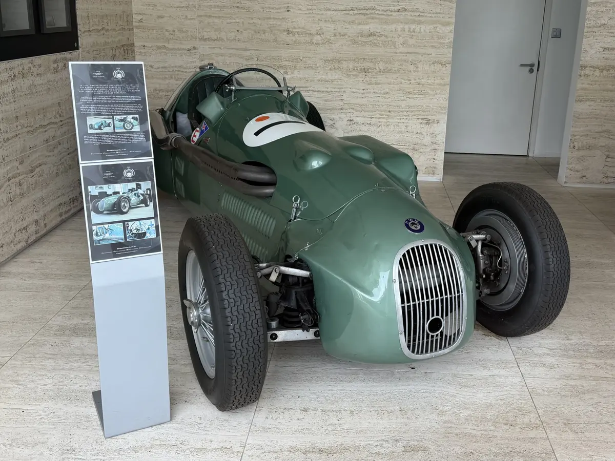 A preserved green HWM single-seater racing car on display at HWM's Bridge Street premises, Walton-on-Thames