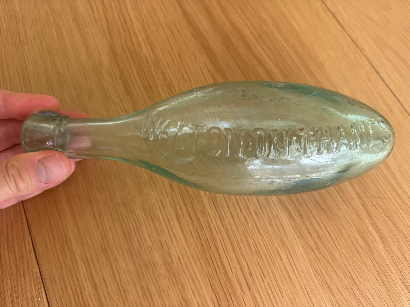 The reverse of the clear Savage & Son bottle, embossed 'WALTON-ON-THAMES'
